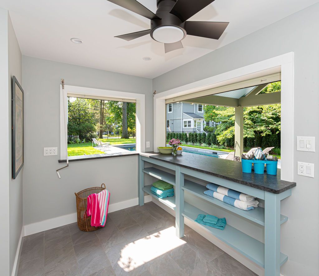 Open-air serving station and towel storage in Florham Park, NJ pool house by G&L and Sons Renovations