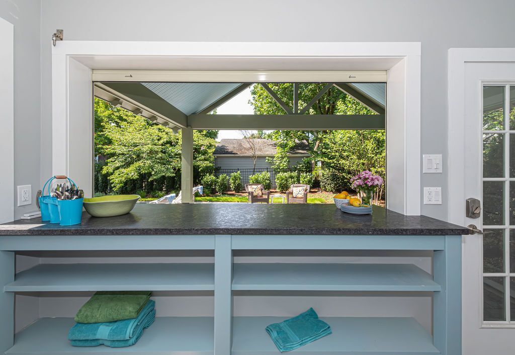 Pass-through serving counter to outdoor patio in Livingston, NJ by G&L and Sons Renovations