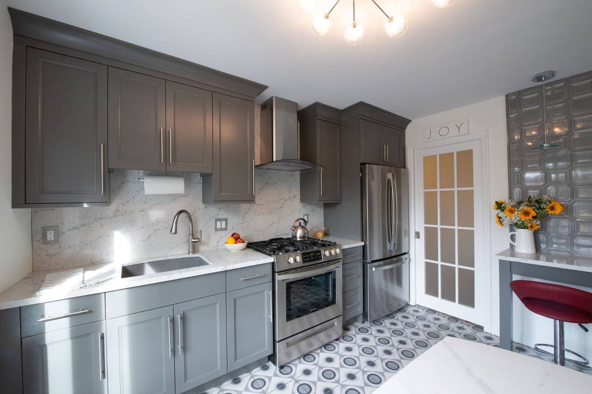 Clifton, NJ modern kitchen with gray cabinetry and patterned tile flooring by G&L and Sons Renovations