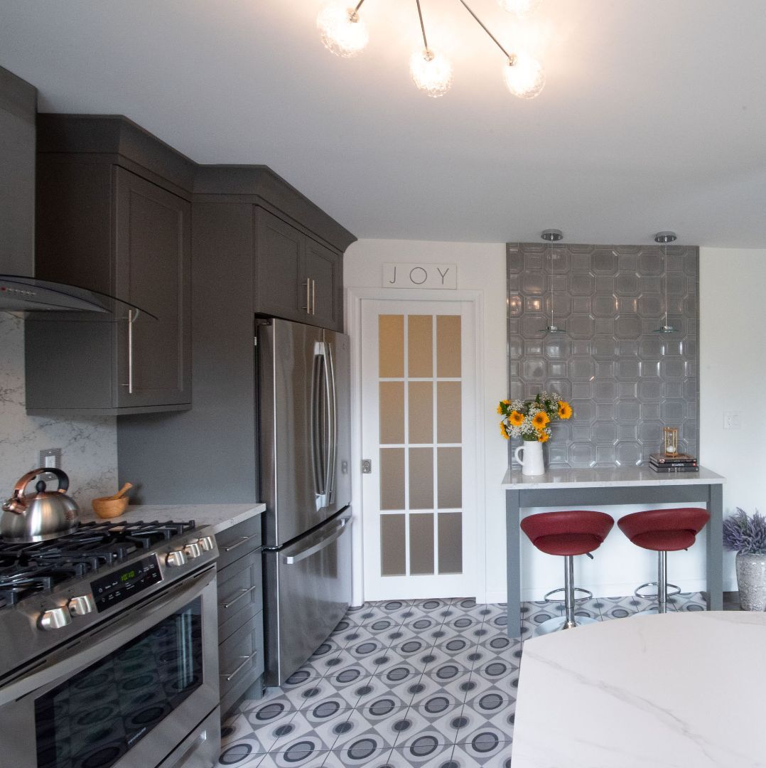 Custom kitchen design with stainless appliances and geometric floor tile in Little Falls, NJ by G&L and Sons Renovations