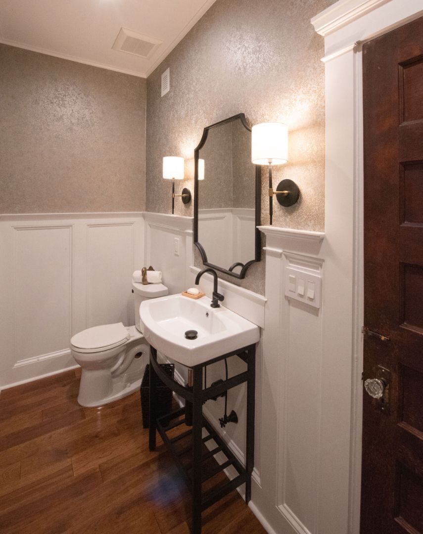 Classic powder room with pedestal sink and wood floors in a custom home by G&L and Sons Renovations, Caldwell, NJ