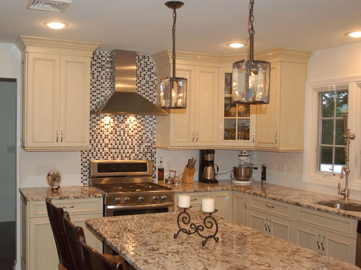 Traditional kitchen with granite surfaces and stainless appliances in Little Falls, NJ by G&L and Sons Renovations