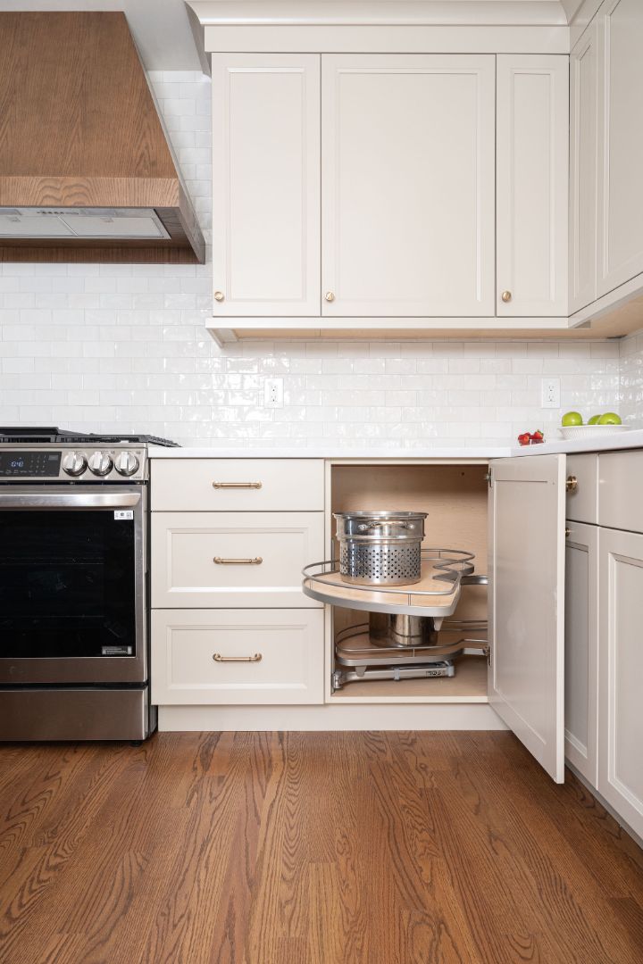Efficient kitchen design with cream cabinetry and hidden storage in a Caldwell, NJ home by G&L and Sons Renovations