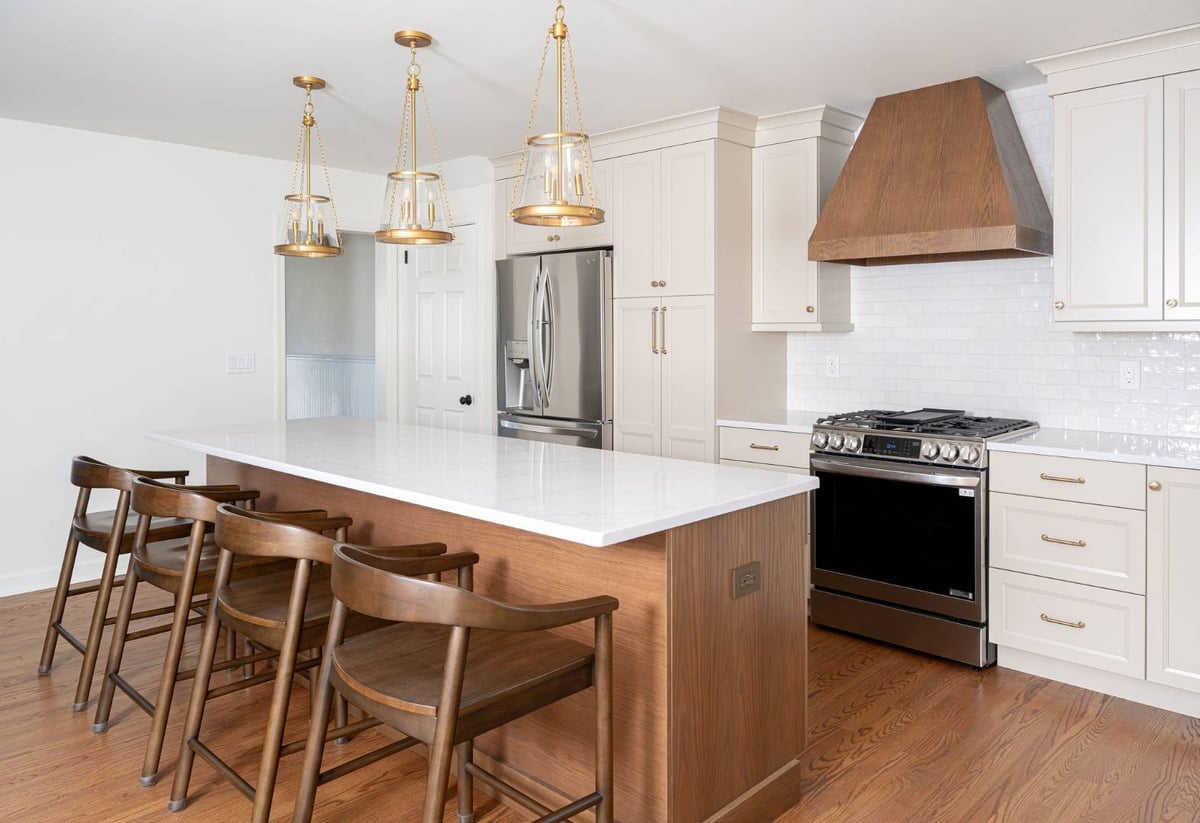 G&L and Sons Renovations custom kitchen in South Orange, NJ with white cabinetry and wood island