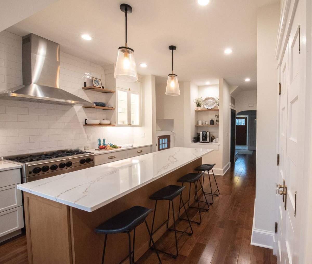 Modern kitchen with quartz waterfall island and stainless hood by G&L and Sons Renovations, Caldwell, NJ