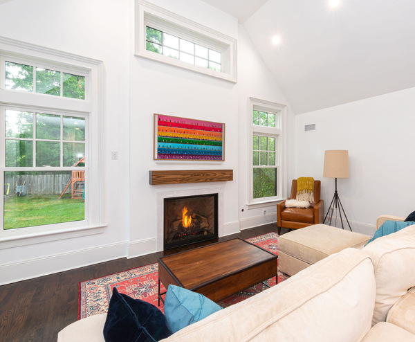 Living room remodel in New Jersey with fireplace and wood mantel